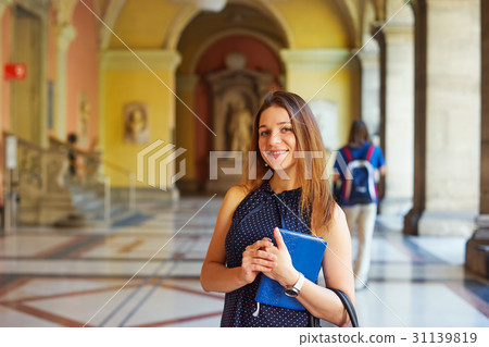 A young woman in front of university building 31139819