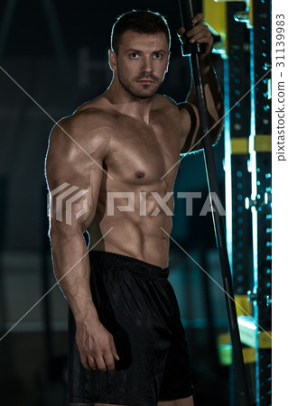 Bodybuilder posing in the gym Bodybuilder posing in the gym 31139983