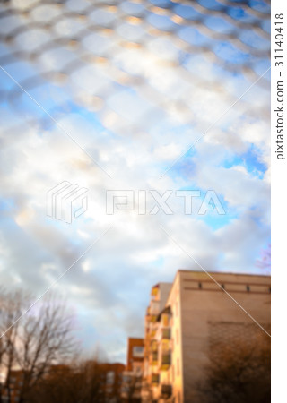 Blue sky behind a metal grate Blue sky behind a metal grate 31140418
