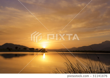 Reflections on the lake in a amazing sunset 31141876
