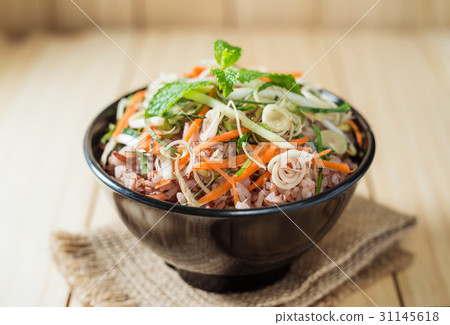 Rice berry with vegetable and herb in black bowl Rice berry with vegetable and herb in black bowl 31145618