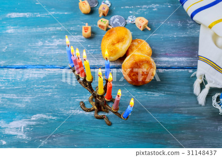 Menorah and donuts for Jewish holiday Hanukkah Menorah and donuts for Jewish holiday Hanukkah 31148437