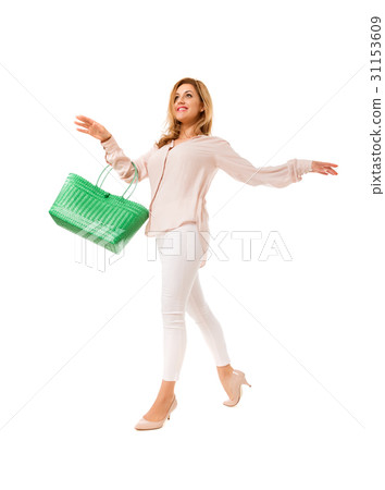 Pretty woman posing with  green tote bag.Isolated. 31153609