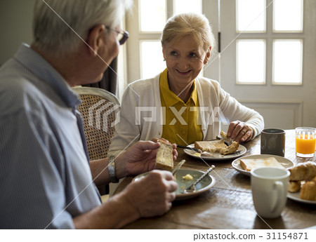 Senior Adult Couple Eat Breakfast Senior Adult Couple Eat Breakfast 31154871