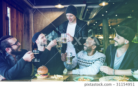 Group of people celebrate party with food and beer Group of people celebrate party with food and beer 31154951