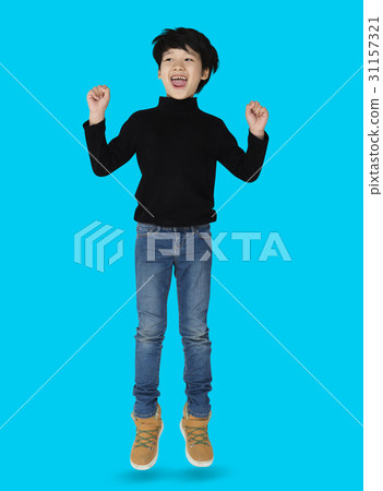A happiness boy is jumping A happiness boy is jumping 31157321