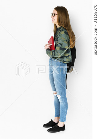 Young Adult Holding Books and School Bag Studio Portrait 31158070