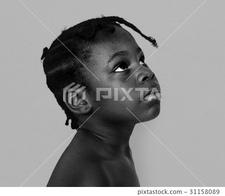 African Descent Boy Looks Up Focused Concentrated 31158089