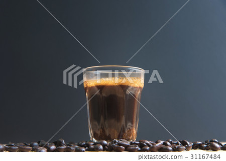 espresso in a glass on wooden table 31167484