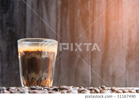 espresso in a glass on wooden table 31167490