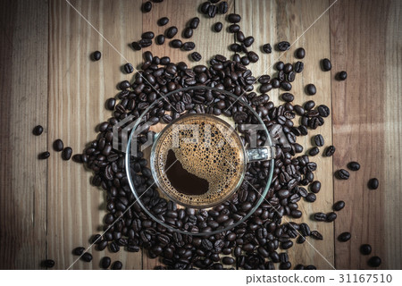 espresso in a glass on wooden table 31167510