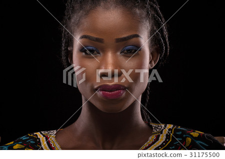 Dark skinned model posing on black background Dark skinned model posing on black background 31175500