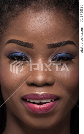 Close up portrait of smiling dark skinned model. Close up portrait of smiling dark skinned model. 31176053