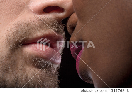 Multi ethnic faces ready to kiss. 31176248