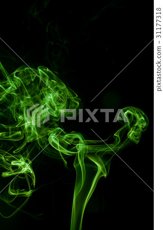 Green smoke movement on black background. 31177318