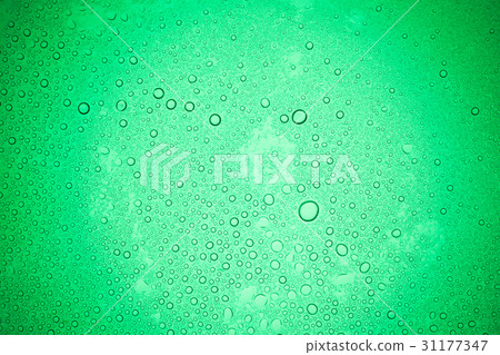 Rain droplets on green glass background. Rain droplets on green glass background. 31177347