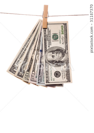 Dollar bills on clothespins on white background.1 31187370