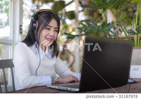 Young Asian woman working with laptop 31187978