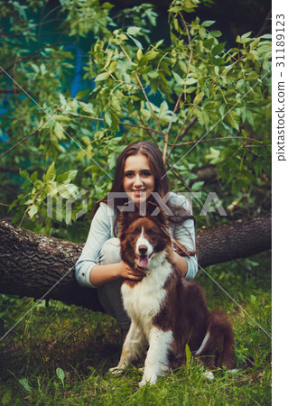 Happy woman with a dog 31189123