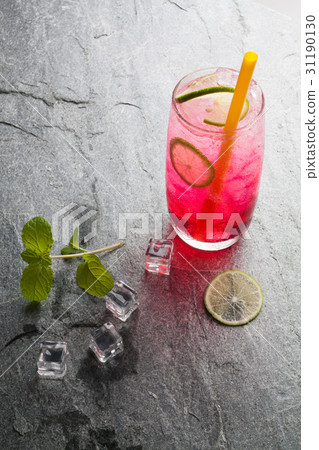 red soda lime drink with lime red soda lime drink with lime 31190130