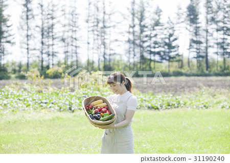 A woman enjoying a family garden A woman enjoying a family garden 31190240