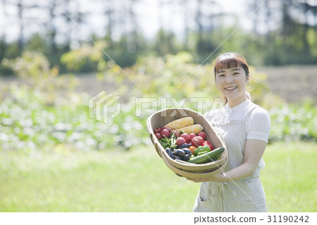 A woman enjoying a family garden 31190242