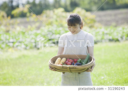 A woman enjoying a family garden A woman enjoying a family garden 31190243