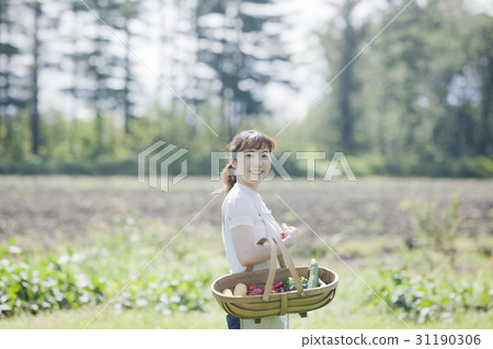 A woman enjoying a family garden 31190306