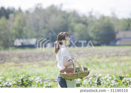 A woman enjoying a family garden A woman enjoying a family garden 31190310
