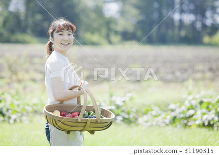 A woman enjoying a family garden 31190315