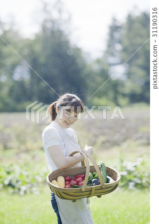 A woman enjoying a family garden 31190316