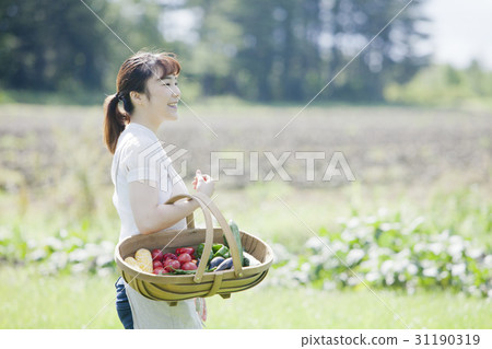 A woman enjoying a family garden 31190319