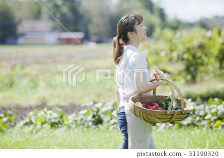 A woman enjoying a family garden 31190320