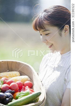 A woman enjoying a family garden 31190322