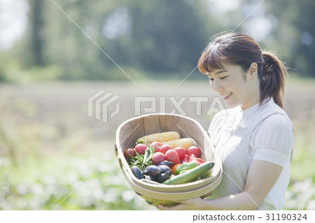 A woman enjoying a family garden 31190324