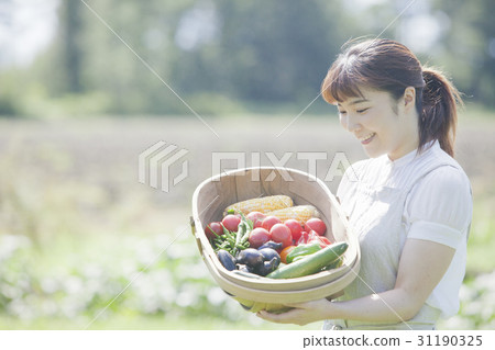 A woman enjoying a family garden 31190325