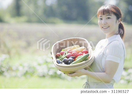A woman enjoying a family garden 31190327