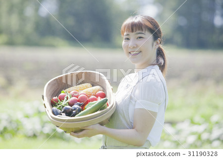 A woman enjoying a family garden 31190328