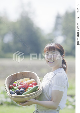 A woman enjoying a family garden 31190329