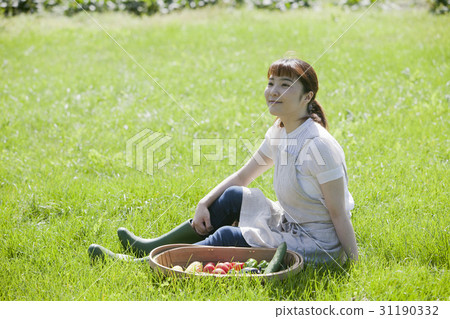 A woman enjoying a family garden A woman enjoying a family garden 31190332