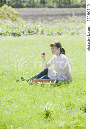 A woman enjoying a family garden 31190340