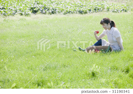 A woman enjoying a family garden 31190341