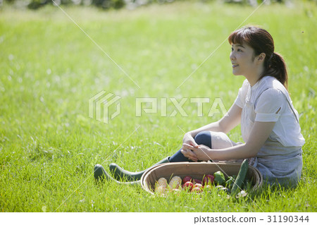 A woman enjoying a family garden 31190344