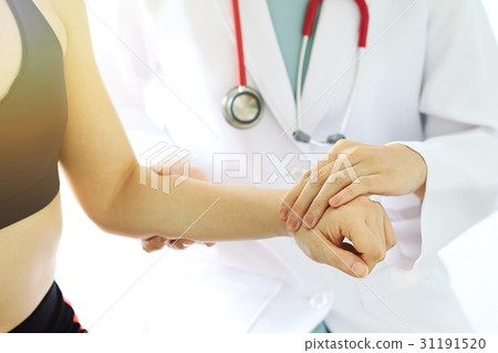 Doctor examining patient, Sport exercise injuries. Doctor examining patient, Sport exercise injuries. 31191520