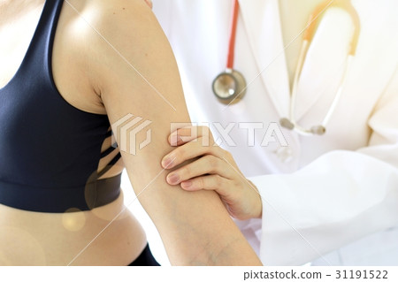 Doctor examining patient, Sport exercise injuries. 31191522