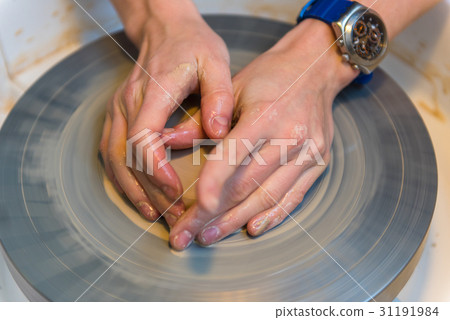 Pottering - creating a clay cup in process 31191984