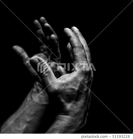 Men's hands on a black background 31193228