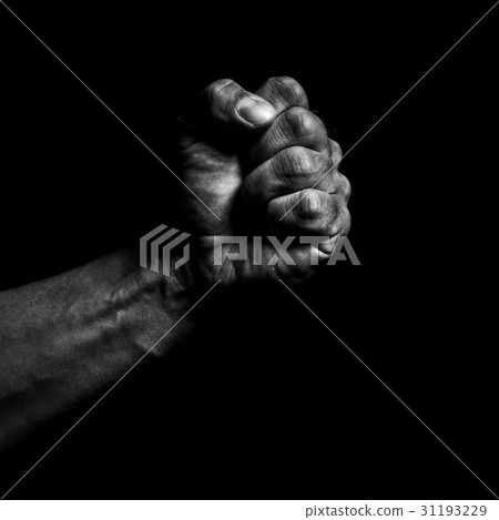 Clenched fist on a black background 31193229
