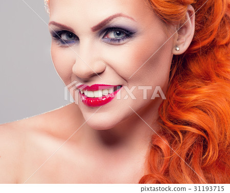 Portrait of beautiful red-haired woman 31193715