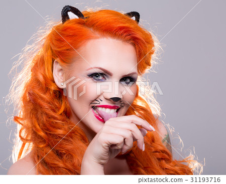 Portrait of beautiful red-haired woman 31193716